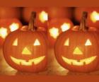 Хэллоуин тыква вырезаны лица и освещенные внутри свечи или Тыква-фонарь
